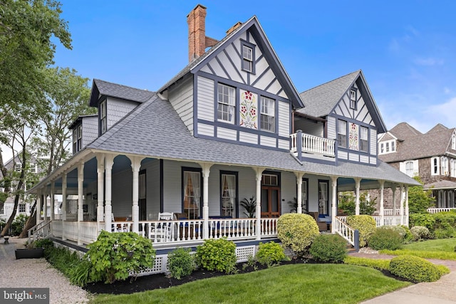 123 Coral St, Beach Haven, NJ 08008 - view of front facade with a shingled roof, a porch, a chimney, and a front lawn