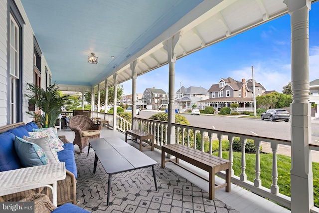 123 Coral St, Beach Haven, NJ 08008 - porch featuring a residential view and outdoor lounge area