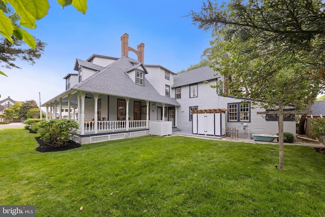 123 Coral St, Beach Haven, NJ 08008 - rear view of property with a porch, a shingled roof, a lawn, a chimney, and central air condition unit