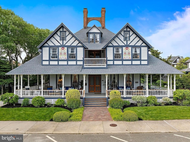 123 Coral St, Beach Haven, NJ 08008 - view of front of home with a shingled roof and a porch