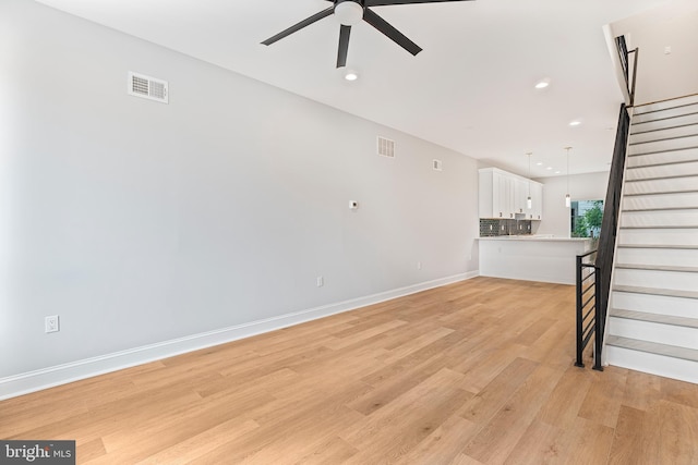 1838 N 4th St, Philadelphia, PA 19122 - unfurnished living room featuring ceiling fan, stairs, light wood-style floors, and recessed lighting