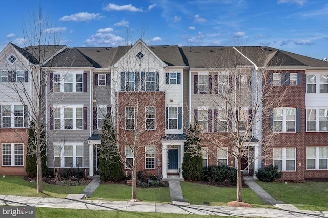 22650 Gray Falcon, Ashburn, VA 20148 - view of front facade featuring a front lawn and brick siding