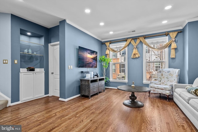 22650 Gray Falcon, Ashburn, VA 20148 - living area featuring wood finished floors, baseboards, crown molding, and recessed lighting