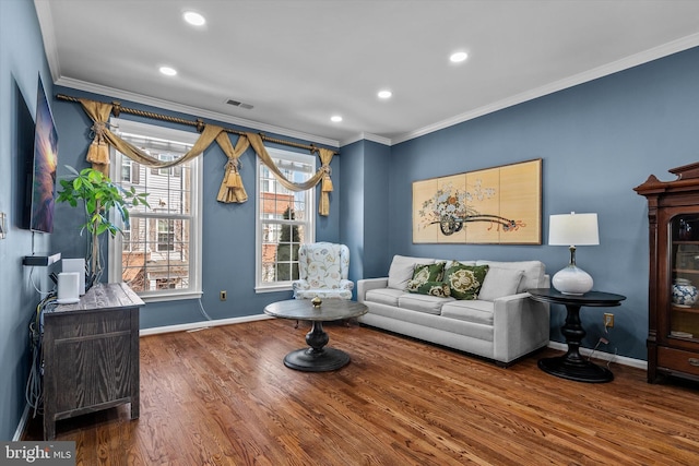 22650 Gray Falcon, Ashburn, VA 20148 - living area featuring wood finished floors, crown molding, baseboards, and recessed lighting