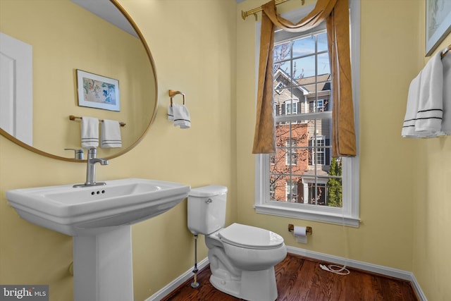 22650 Gray Falcon, Ashburn, VA 20148 - bathroom featuring baseboards, toilet, and wood finished floors