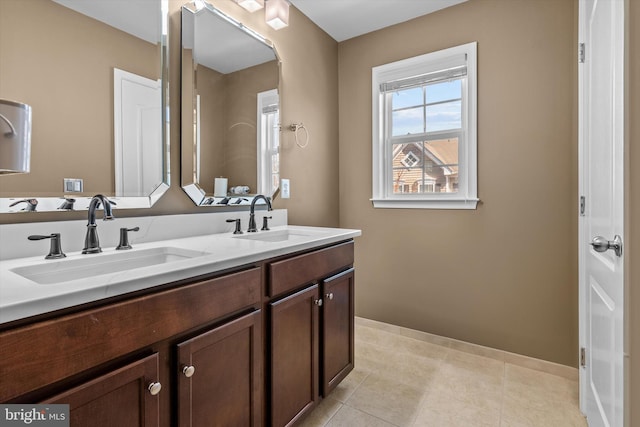 22650 Gray Falcon, Ashburn, VA 20148 - bathroom with double vanity, baseboards, and tile patterned floors
