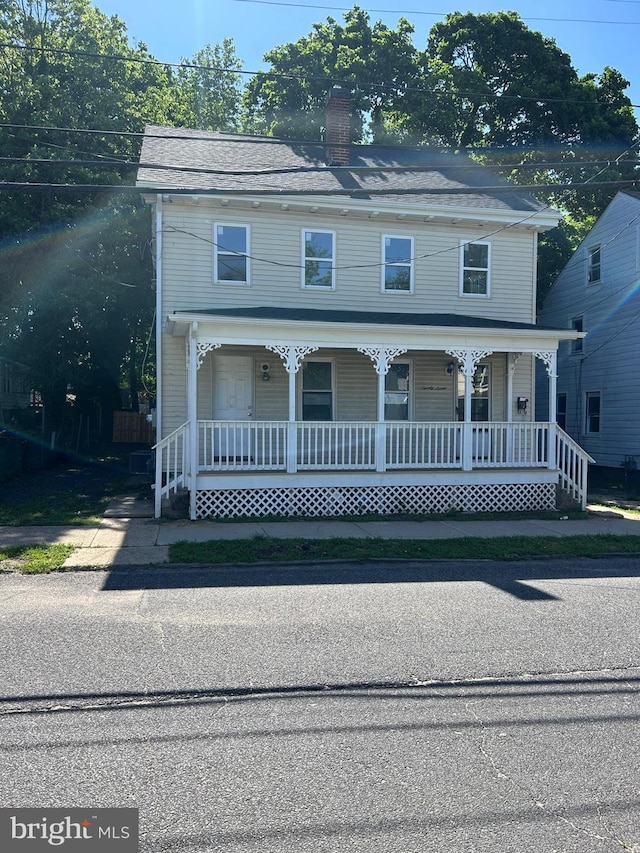 27 Church St, Bridgeton, NJ 08302 - view of front of home with a porch and a chimney