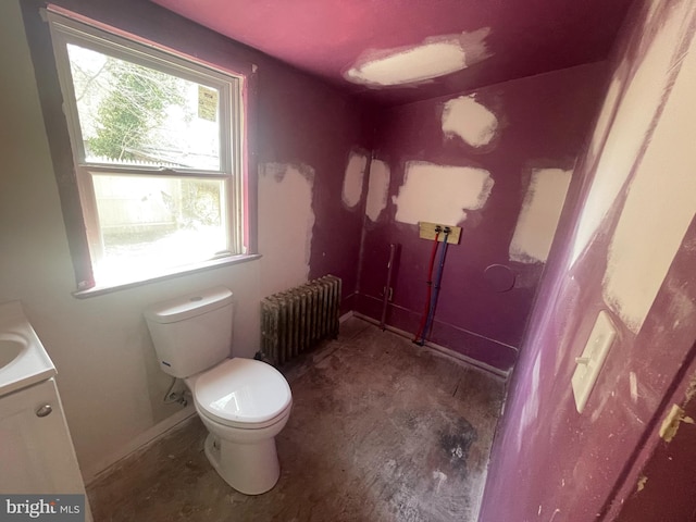 27 Church St, Bridgeton, NJ 08302 - bathroom with radiator heating unit, toilet, vanity, and baseboards