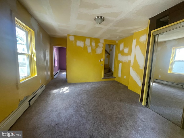 27 Church St, Bridgeton, NJ 08302 - empty room with a baseboard radiator, carpet floors, and stairway