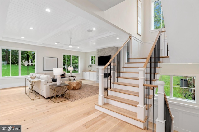 6613 Byrnes Dr, Mclean, VA 22101 - living room with wood finished floors, recessed lighting, stairs, a ceiling fan, and wood ceiling with exposed beams