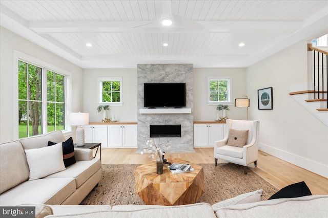 6613 Byrnes Dr, Mclean, VA 22101 - living area with light wood-type flooring, stairway, a high end fireplace, plenty of natural light, and recessed lighting
