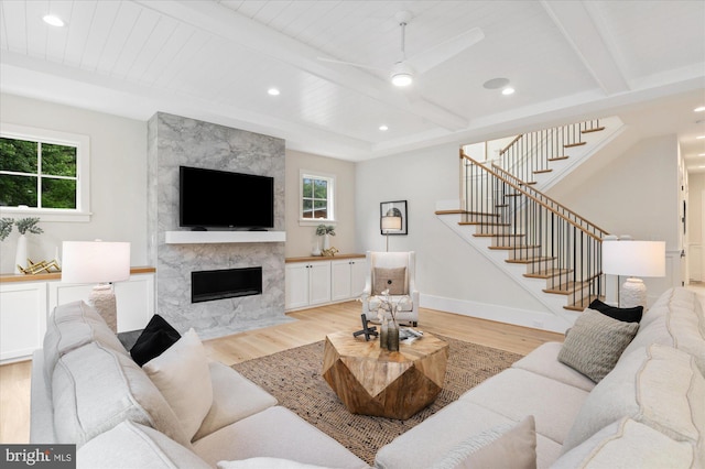 6613 Byrnes Dr, Mclean, VA 22101 - living area featuring light wood finished floors, stairs, a fireplace, ceiling fan, and recessed lighting