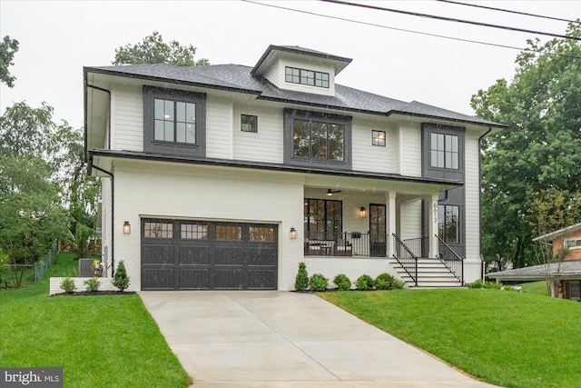 6613 Byrnes Dr, Mclean, VA 22101 - view of front of home with covered porch, a garage, a front yard, and driveway
