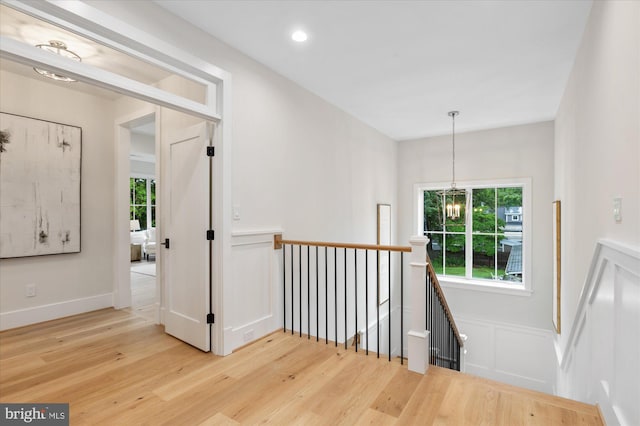 6613 Byrnes Dr, Mclean, VA 22101 - hall with an upstairs landing, wood finished floors, plenty of natural light, a chandelier, and recessed lighting