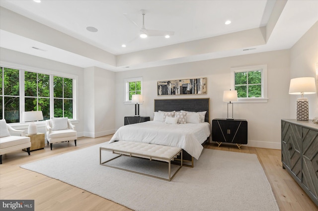 6613 Byrnes Dr, Mclean, VA 22101 - bedroom with baseboards, light wood-type flooring, a tray ceiling, and recessed lighting