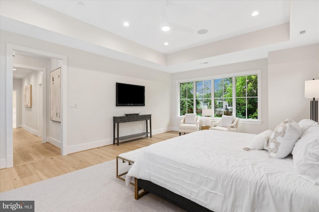 6613 Byrnes Dr, Mclean, VA 22101 - bedroom featuring light wood-style flooring, baseboards, recessed lighting, and a tray ceiling