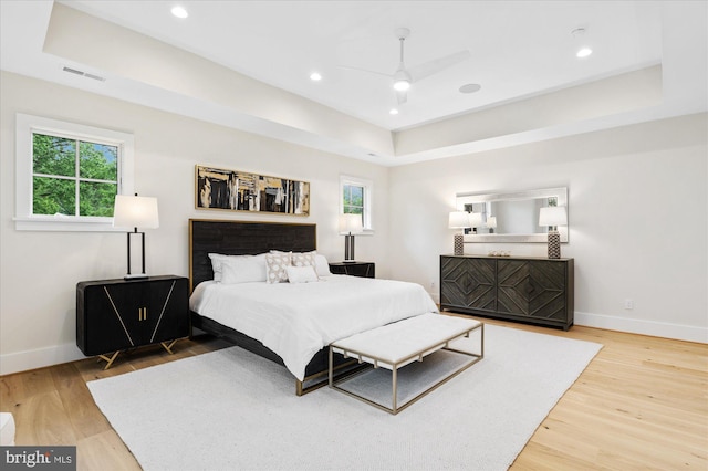 6613 Byrnes Dr, Mclean, VA 22101 - bedroom featuring a tray ceiling, wood finished floors, baseboards, recessed lighting, and ceiling fan