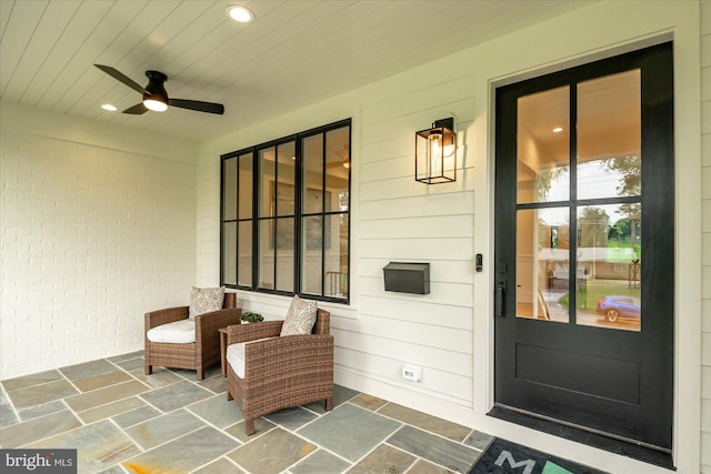 6613 Byrnes Dr, Mclean, VA 22101 - property entrance featuring ceiling fan, brick siding, and covered porch