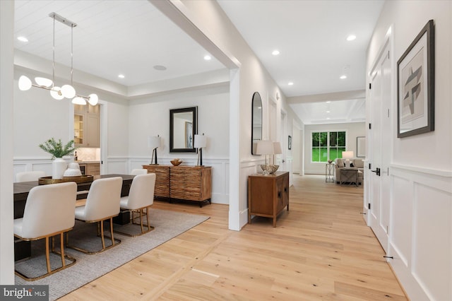 6613 Byrnes Dr, Mclean, VA 22101 - dining room with a decorative wall, light wood-type flooring, wainscoting, and recessed lighting