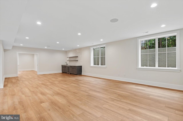 6613 Byrnes Dr, Mclean, VA 22101 - unfurnished living room with light wood-style floors, baseboards, and recessed lighting