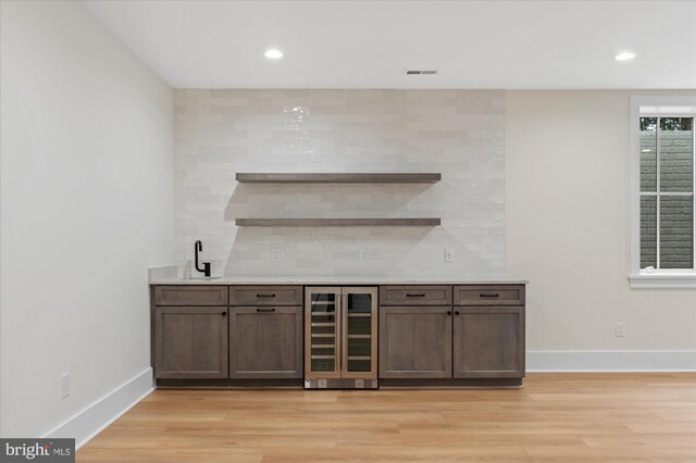 6613 Byrnes Dr, Mclean, VA 22101 - indoor wet bar with wine cooler, light wood-style floors, decorative backsplash, baseboards, and recessed lighting