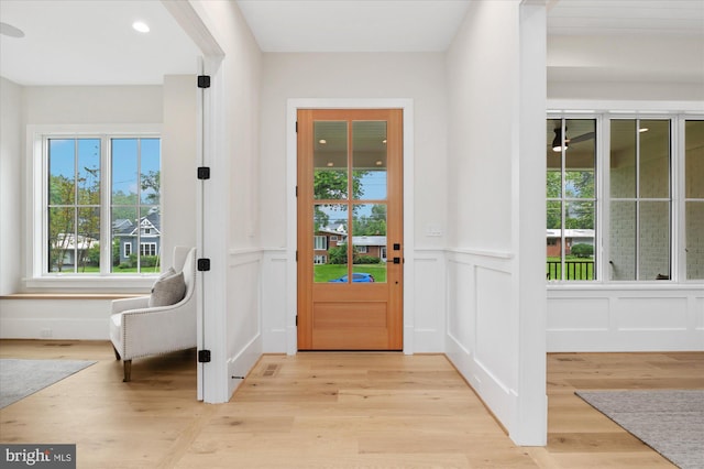 6613 Byrnes Dr, Mclean, VA 22101 - foyer with a decorative wall, light wood-style floors, wainscoting, and recessed lighting