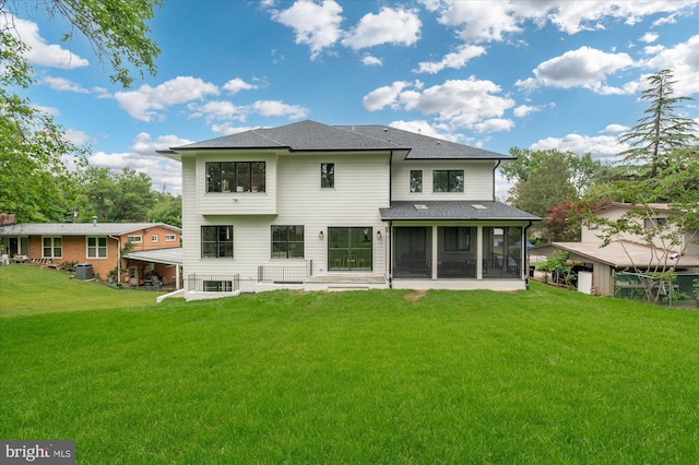 6613 Byrnes Dr, Mclean, VA 22101 - rear view of property with a sunroom, a shingled roof, a yard, a patio, and central AC