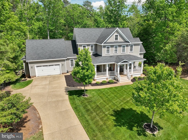 3225 Oak Branch Ln, Toano, VA 23168 - view of front of home featuring a porch, concrete driveway, a garage, a front lawn, and a shingled roof