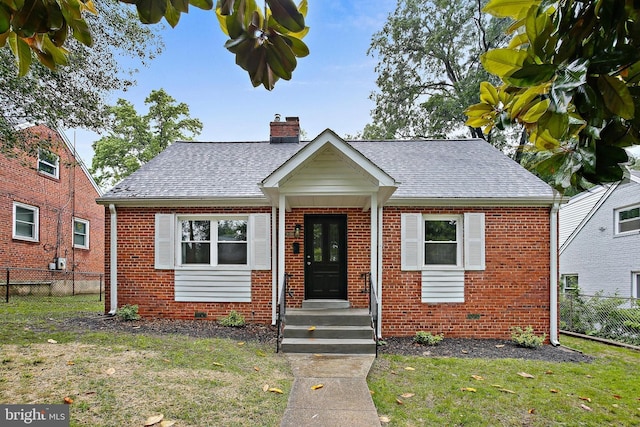 5210 57th Ave, Hyattsville, MD 20781 - bungalow-style house featuring brick siding, a chimney, and roof with shingles