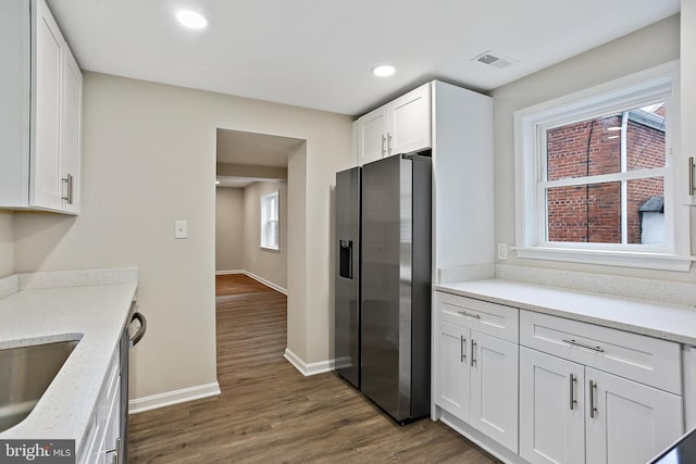 5210 57th Ave, Hyattsville, MD 20781 - kitchen with stainless steel fridge with ice dispenser, white cabinets, dark wood-type flooring, baseboards, and recessed lighting