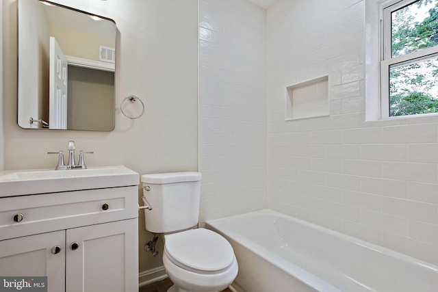 5210 57th Ave, Hyattsville, MD 20781 - bathroom featuring toilet, vanity, and washtub / shower combination