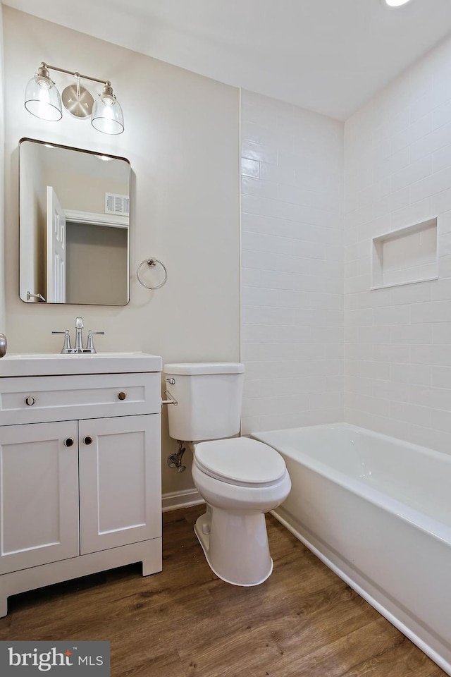 5210 57th Ave, Hyattsville, MD 20781 - full bathroom with toilet, wood finished floors, and vanity