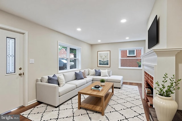 5210 57th Ave, Hyattsville, MD 20781 - living room with plenty of natural light, light wood-style floors, a fireplace, and recessed lighting