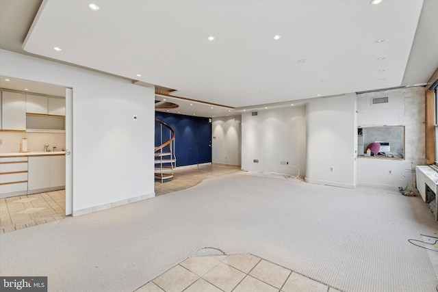 50 Belmont Ave Unit 1016/1116, Bala Cynwyd, PA 19004 - unfurnished living room featuring light carpet, stairs, recessed lighting, light tile patterned flooring, and baseboards