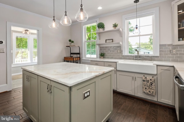1704 N Royal Ave, Front Royal, VA 22630 - kitchen featuring ornamental molding, dark wood-type flooring, decorative backsplash, a center island, and stainless steel dishwasher