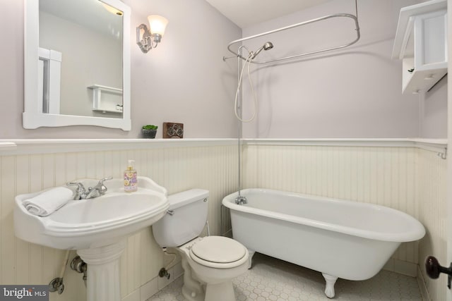 1704 N Royal Ave, Front Royal, VA 22630 - full bathroom with a wainscoted wall, a freestanding bath, and tile patterned flooring