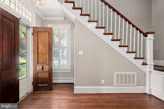 1704 N Royal Ave, Front Royal, VA 22630 - foyer featuring a baseboard heating unit, wood finished floors, crown molding, stairway, and plenty of natural light
