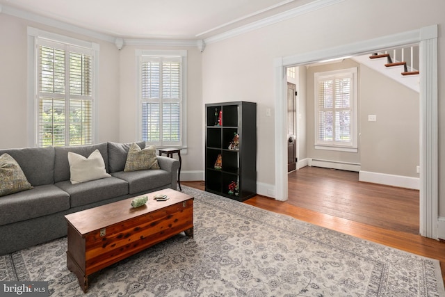 1704 N Royal Ave, Front Royal, VA 22630 - living area with ornamental molding, baseboard heating, wood finished floors, and stairs