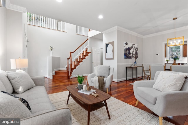 1318 S Kenmore Cir, Arlington, VA 22204 - living room featuring stairway, a chandelier, wood finished floors, ornamental molding, and baseboards
