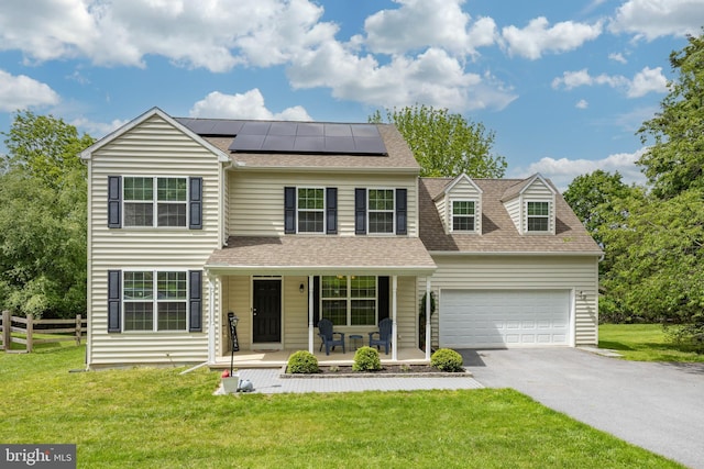 3237 Walnut St, Downingtown, PA 19335 - view of front facade with covered porch, driveway, solar panels, a shingled roof, and a garage