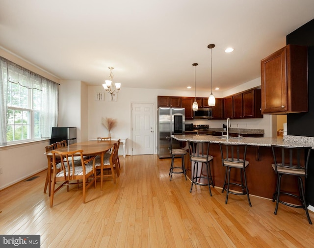 3237 Walnut St, Downingtown, PA 19335 - dining area featuring light wood-style flooring, a chandelier, recessed lighting, and baseboards