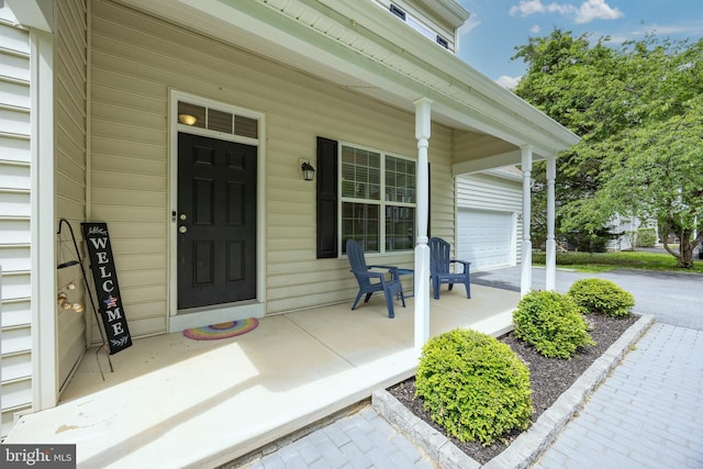 3237 Walnut St, Downingtown, PA 19335 - property entrance featuring a porch and a garage