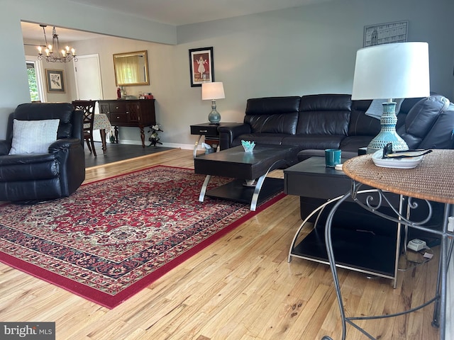 95 Knapp Ave, Hamilton, NJ 08610 - living room featuring a chandelier, wood finished floors, and baseboards