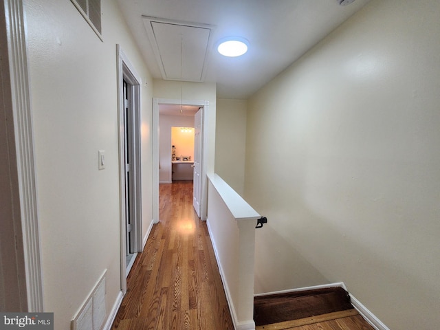 74 Probasco Rd, Hightstown, NJ 08520 - hallway featuring attic access, wood finished floors, an upstairs landing, and baseboards
