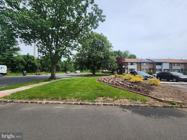74 Probasco Rd, Hightstown, NJ 08520 - view of front facade featuring a front yard, uncovered parking, and a residential view
