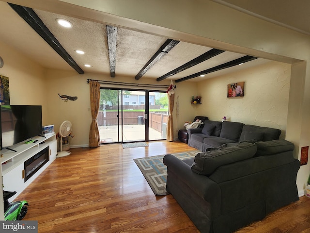 74 Probasco Rd, Hightstown, NJ 08520 - living area with beam ceiling, wood finished floors, baseboards, and recessed lighting