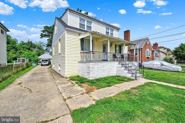 15 Homberg Ave, Baltimore, MD 21221 - view of front facade featuring a porch