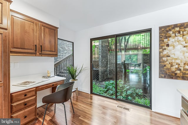 2127 Cabots Point Ln, Reston, VA 20191 - office area featuring light wood-style flooring and built in study area