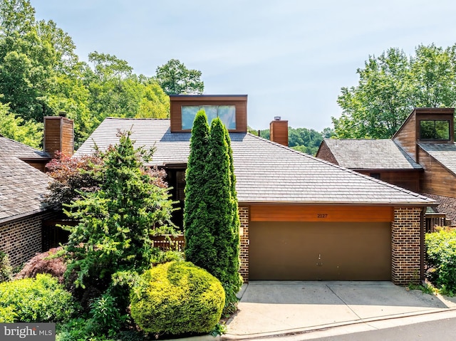 2127 Cabots Point Ln, Reston, VA 20191 - view of front of property featuring a chimney, brick siding, an attached garage, driveway, and a high end roof