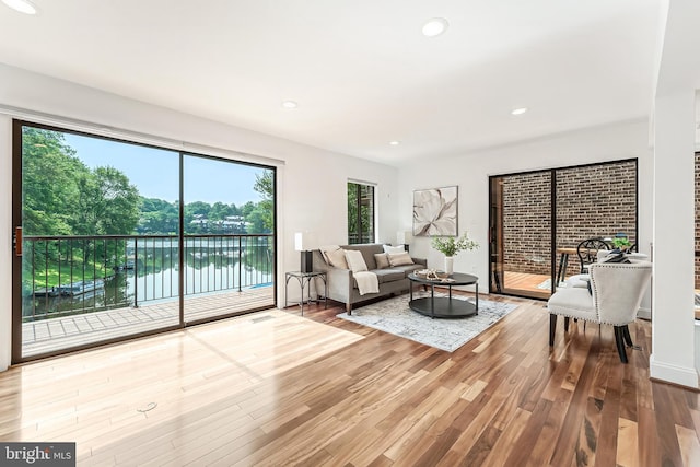 2127 Cabots Point Ln, Reston, VA 20191 - living area featuring wood finished floors, recessed lighting, and a water view